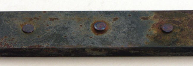 What is corrosion; Copper rivet on steel piece immersed in 3% sodium chloride solution after 10 months